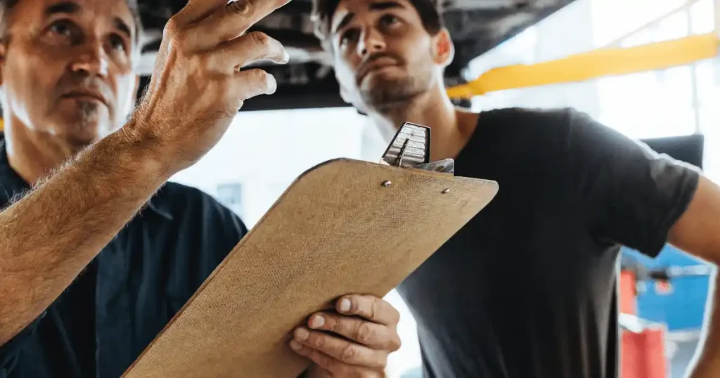 2 people checking garage door