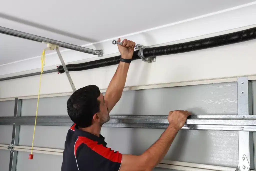 expert repairing garage door spring